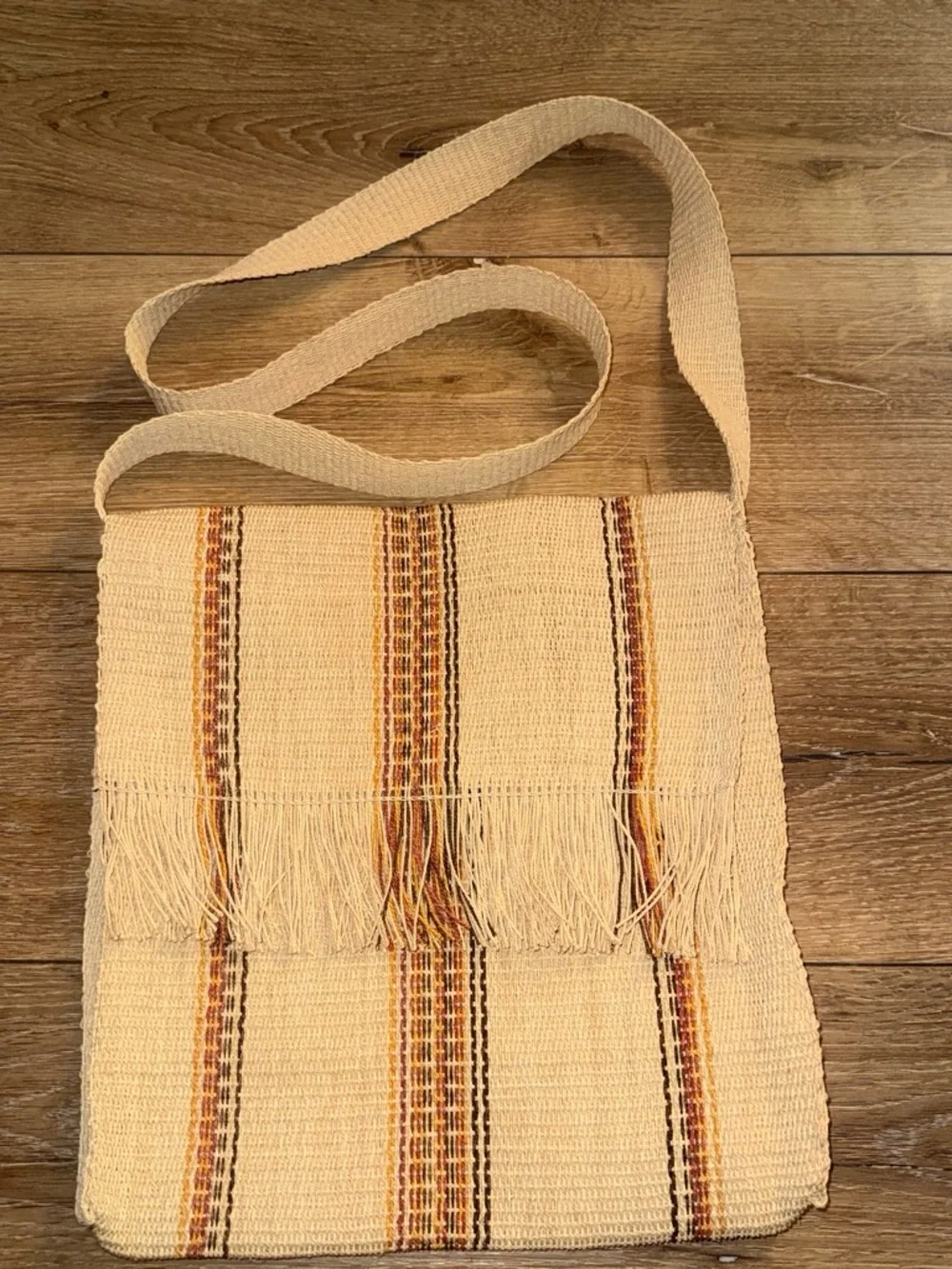 Handmade woven tote bag with vertical stripes in beige, brown, and orange
